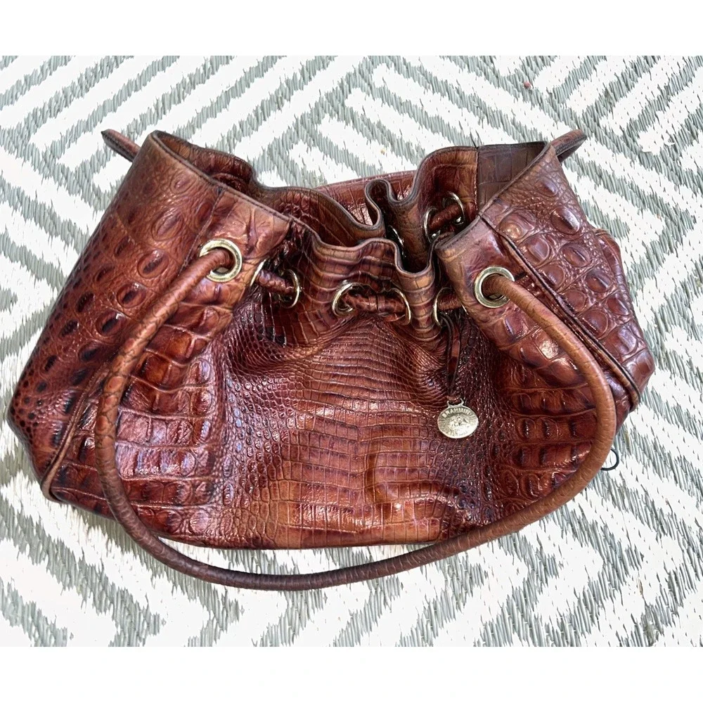 brown Brahmin bucket bag features croc-embossed leather